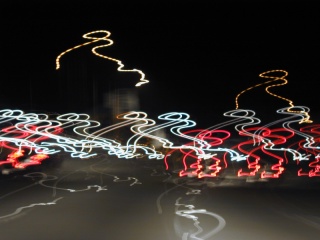 Freeway at night, through windshield at speed; 2 sec exposure. Click to see 800x600. [C-2000Z]